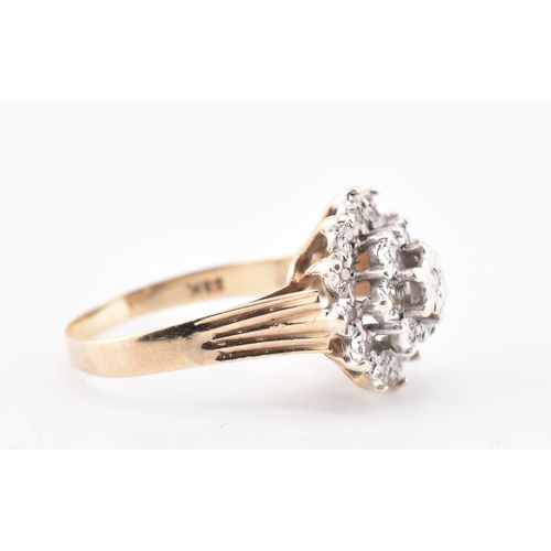 162 - A hallmarked 9ct gold and diamond cluster ring. The 9ct yellow gold ring set with a cluster of ninet... 