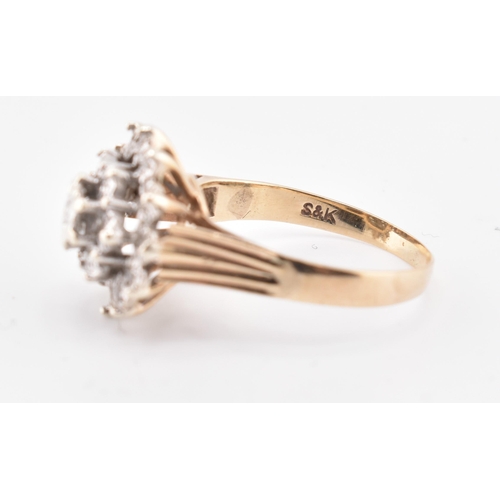 162 - A hallmarked 9ct gold and diamond cluster ring. The 9ct yellow gold ring set with a cluster of ninet... 