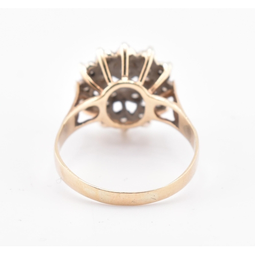 162 - A hallmarked 9ct gold and diamond cluster ring. The 9ct yellow gold ring set with a cluster of ninet... 