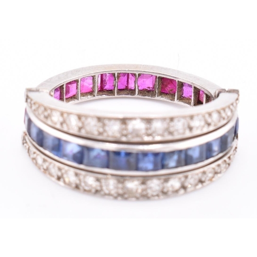 165 - An Art Deco sapphire, ruby and diamond flip ring. The Art Deco 'day and night ring' ring having a ce... 