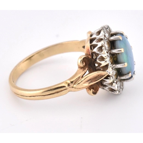 166 - A hallmarked 9ct gold, opal and diamond cluster ring. The 9ct yellow gold ring set with a central ov... 