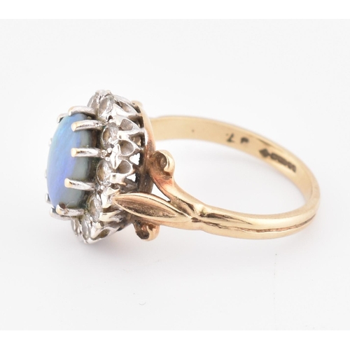 166 - A hallmarked 9ct gold, opal and diamond cluster ring. The 9ct yellow gold ring set with a central ov... 