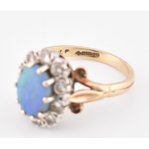 166 - A hallmarked 9ct gold, opal and diamond cluster ring. The 9ct yellow gold ring set with a central ov... 