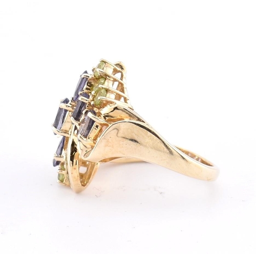 168 - A hallmarked 9ct gold peridot and iolite cluster ring. The 9ct yellow gold ring set with four oval c... 