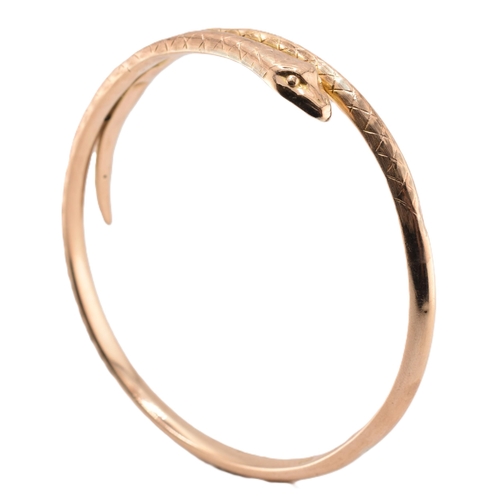 17 - A 19th-century hallmarked 9ct gold snake bangle. The bangle with textured and etched body. Hallmarke... 