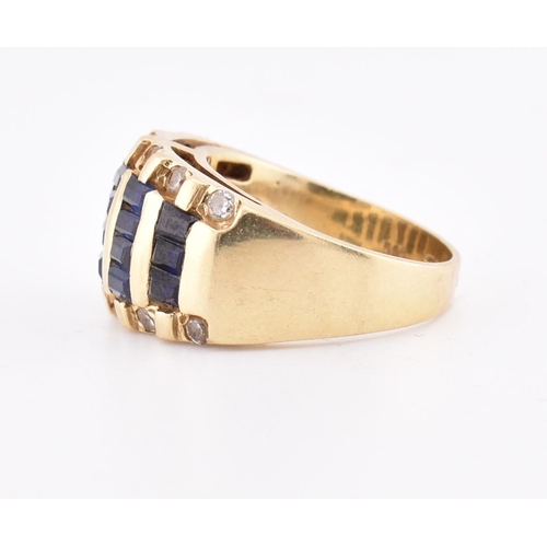 172 - A 14ct gold blue and white sapphire dome ring. The yellow gold ring five rows of calibre blue sapphi... 