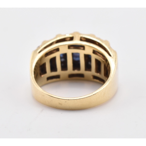 172 - A 14ct gold blue and white sapphire dome ring. The yellow gold ring five rows of calibre blue sapphi... 