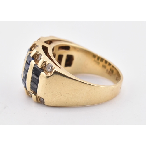 172 - A 14ct gold blue and white sapphire dome ring. The yellow gold ring five rows of calibre blue sapphi... 