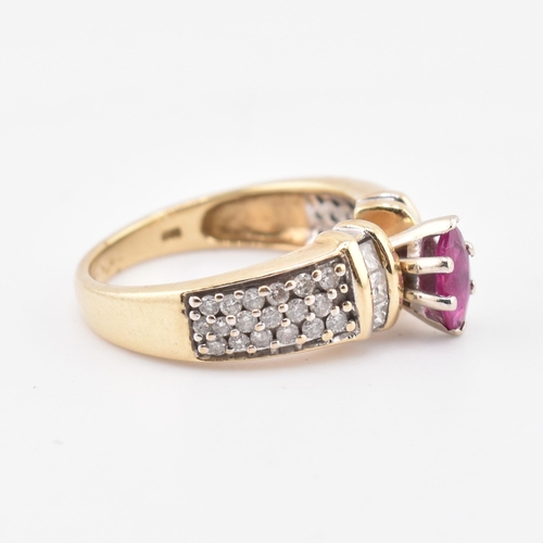 182 - A 14ct gold ruby and diamond ring. The ring set with a central marquise cut ruby flanked by two colu... 