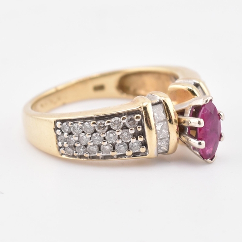 182 - A 14ct gold ruby and diamond ring. The ring set with a central marquise cut ruby flanked by two colu... 