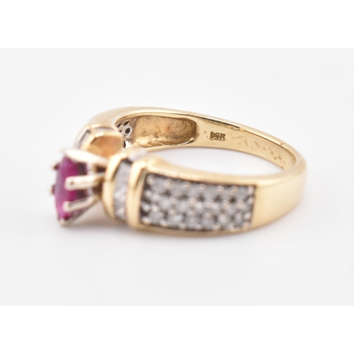 182 - A 14ct gold ruby and diamond ring. The ring set with a central marquise cut ruby flanked by two colu... 