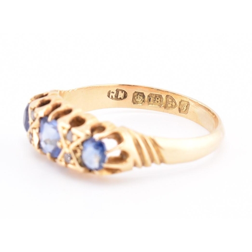 186 - An Edwardian hallmarked 18ct gold sapphire and diamond ring. The ring set with a central cushion cut... 