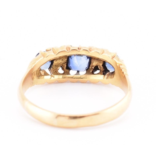 186 - An Edwardian hallmarked 18ct gold sapphire and diamond ring. The ring set with a central cushion cut... 