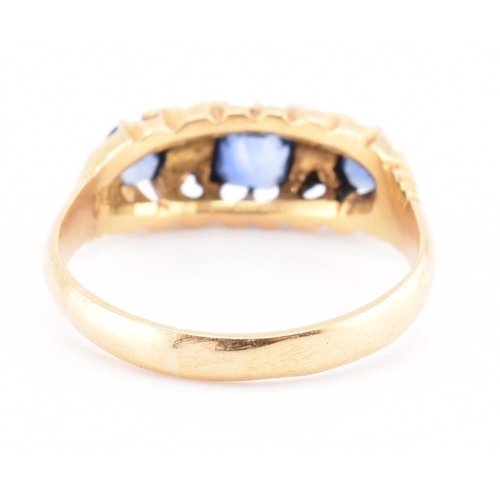 186 - An Edwardian hallmarked 18ct gold sapphire and diamond ring. The ring set with a central cushion cut... 