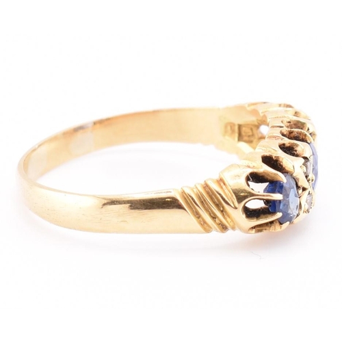 186 - An Edwardian hallmarked 18ct gold sapphire and diamond ring. The ring set with a central cushion cut... 