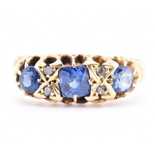 186 - An Edwardian hallmarked 18ct gold sapphire and diamond ring. The ring set with a central cushion cut... 