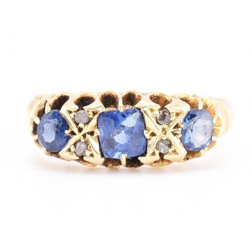 186 - An Edwardian hallmarked 18ct gold sapphire and diamond ring. The ring set with a central cushion cut... 