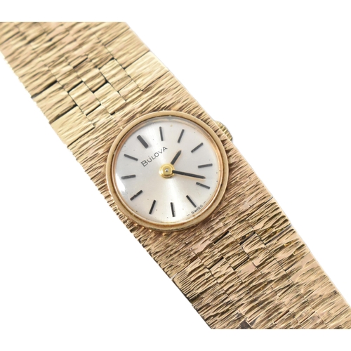 19 - A hallmarked 9ct gold Bulova wristwatch. The 1970s hallmarked 9ct gold Bulova wristwatch having a ro... 