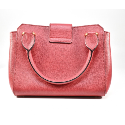 2 - A Burberry red buckle bag with crossbody strap. The Burberry 'The Buckle' bag having a red soft calf... 