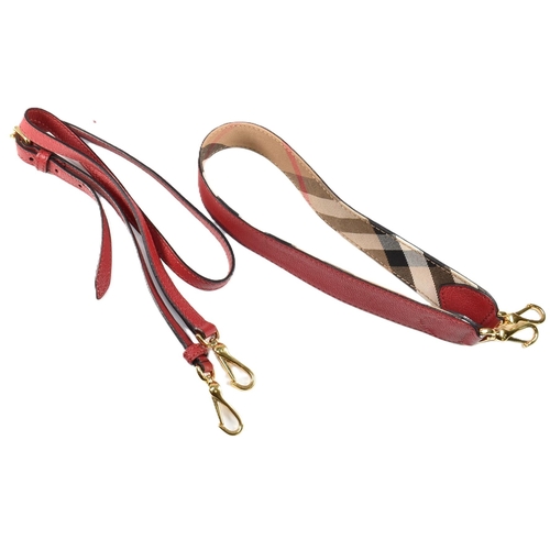 2 - A Burberry red buckle bag with crossbody strap. The Burberry 'The Buckle' bag having a red soft calf... 