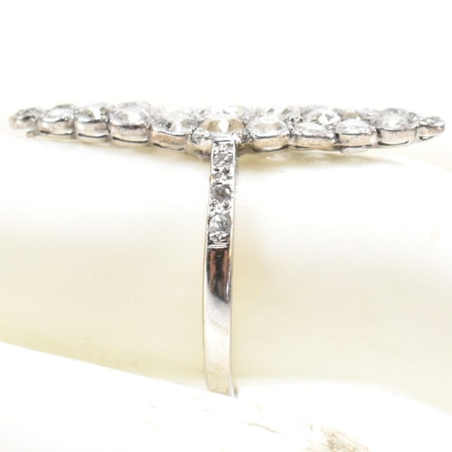 200a - A diamond cluster ring. The ring having a marquise shaped head set with 35 diamonds largely old cut ... 