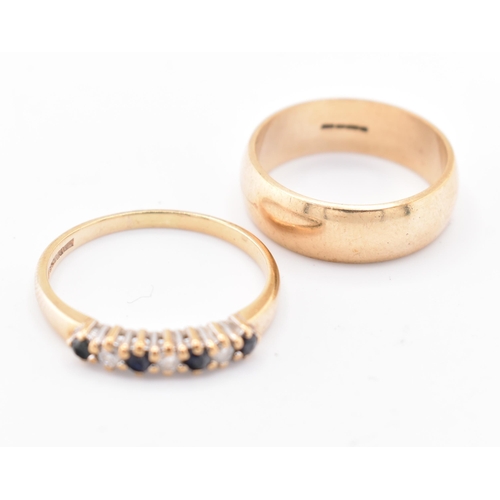 201 - A hallmarked 9ct gold band ring and a hallmarked 9ct gold, sapphire and diamond half hoop ring. The ... 