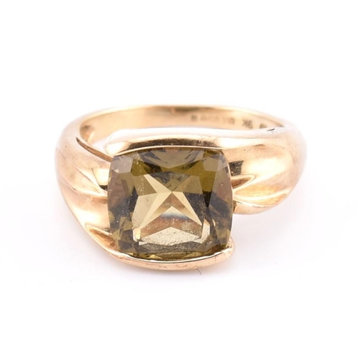 207 - A hallmarked 9ct gold and imperial topaz ring. The ring set with a single half bezel set cushion cut... 