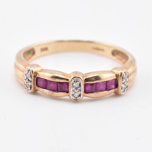 212 - A hallmarked 9ct gold ruby and diamond ring. The 9ct yellow gold ring set with six channel set squar... 