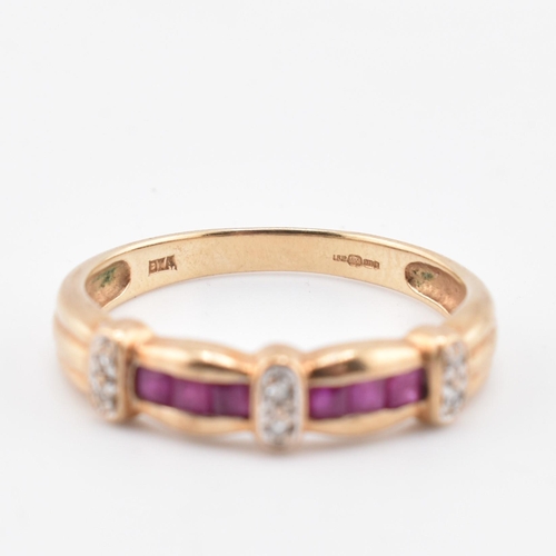 212 - A hallmarked 9ct gold ruby and diamond ring. The 9ct yellow gold ring set with six channel set squar... 