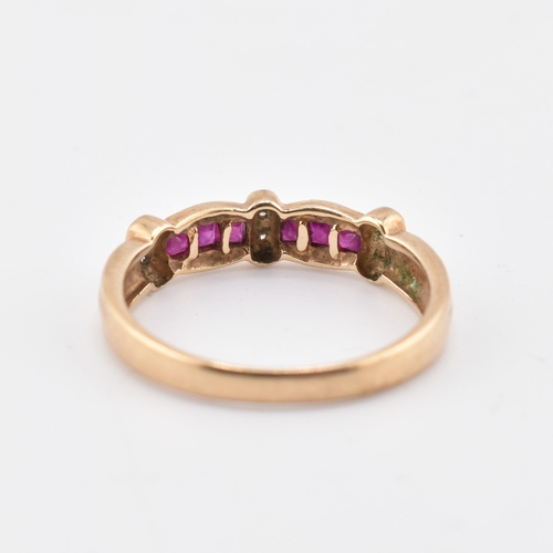 212 - A hallmarked 9ct gold ruby and diamond ring. The 9ct yellow gold ring set with six channel set squar... 