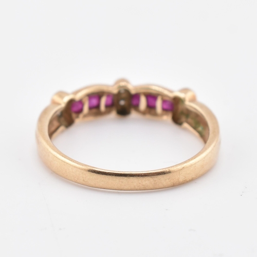 212 - A hallmarked 9ct gold ruby and diamond ring. The 9ct yellow gold ring set with six channel set squar... 