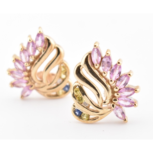 213 - A pair of hallmarked 9ct gold, pink sapphire, blue sapphire and white topaz stud earrings. The 9ct y... 