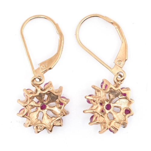 216 - A pair of ruby and opal floral cluster pendant earrings with French lever clasps. The earrings stamp... 