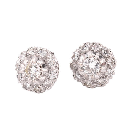 21A - A pair of diamond cluster stud earrings cased. The stud earrings set with a central claw set round b... 