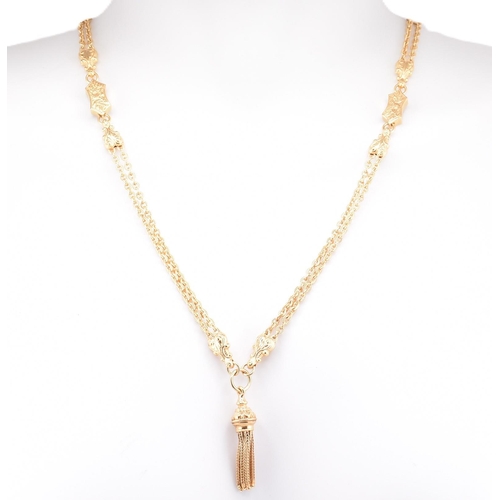 22 - A hallmarked 9ct gold tassel chain necklace. The 9ct yellow gold necklace having a tassel pendant su... 