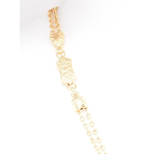 22 - A hallmarked 9ct gold tassel chain necklace. The 9ct yellow gold necklace having a tassel pendant su... 