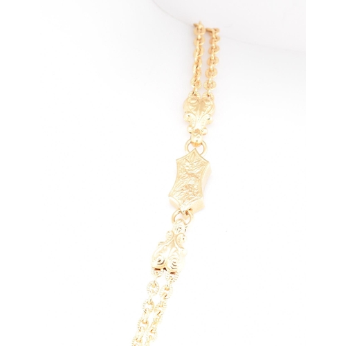 22 - A hallmarked 9ct gold tassel chain necklace. The 9ct yellow gold necklace having a tassel pendant su... 