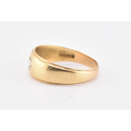 220 - A hallmarked 18ct gold and diamond band ring. The 18ct yellow gold ring set with a single star set r... 