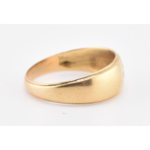 220 - A hallmarked 18ct gold and diamond band ring. The 18ct yellow gold ring set with a single star set r... 