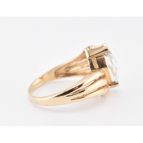 225 - A hallmarked 9ct gold and green amethyst crossover ring. The 9ct yellow gold ring set with a single ... 