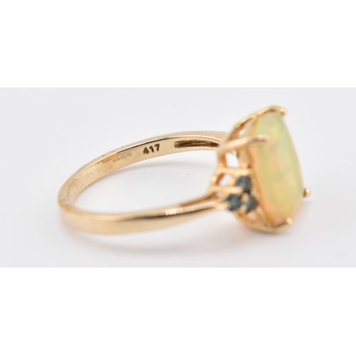 240 - A hallmarked 9ct gold Ethiopian opal and Arusha colour change garnet ring. The 9ct yellow gold ring ... 