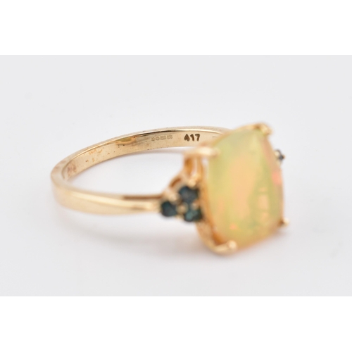 240 - A hallmarked 9ct gold Ethiopian opal and Arusha colour change garnet ring. The 9ct yellow gold ring ... 