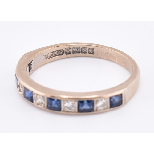 241 - A hallmarked 18ct gold sapphire and diamond half hoop ring. The 18ct white gold ring set with six ch... 