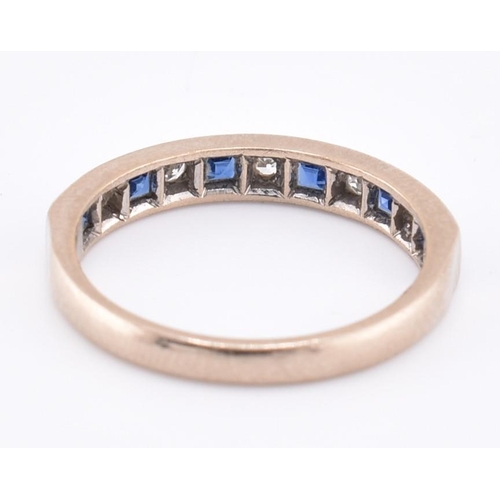 241 - A hallmarked 18ct gold sapphire and diamond half hoop ring. The 18ct white gold ring set with six ch... 