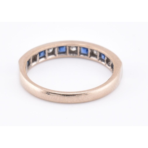 241 - A hallmarked 18ct gold sapphire and diamond half hoop ring. The 18ct white gold ring set with six ch... 