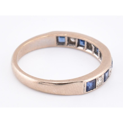 241 - A hallmarked 18ct gold sapphire and diamond half hoop ring. The 18ct white gold ring set with six ch... 