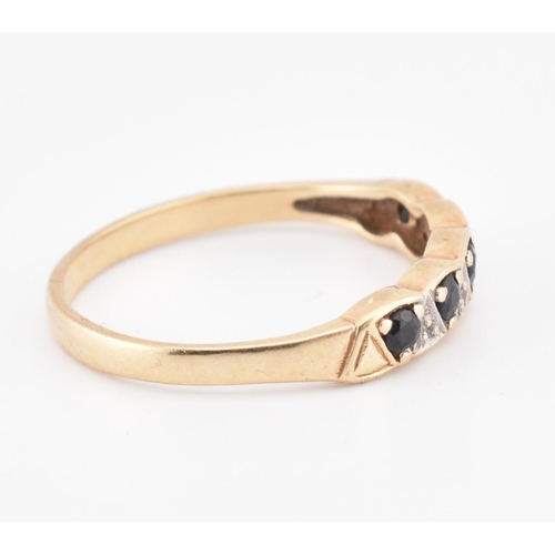 244 - A hallmarked 9ct gold sapphire and diamond half hoop ring. The 9ct yellow gold ring set with five ro... 