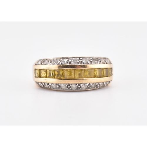 245 - A hallmarked 9ct gold, yellow sapphire and diamond ring. The 9ct yellow gold ring having a central r... 