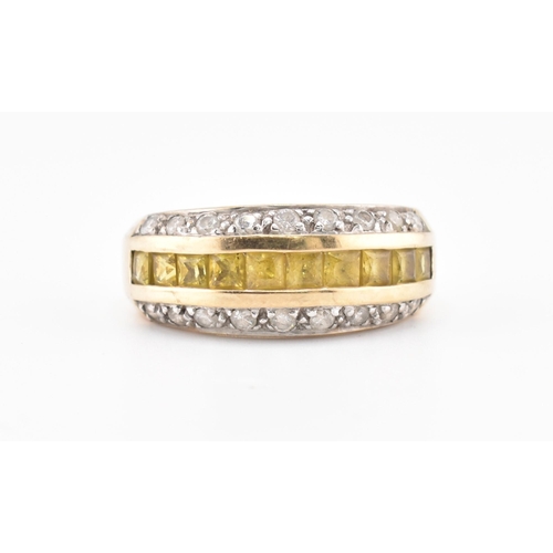 245 - A hallmarked 9ct gold, yellow sapphire and diamond ring. The 9ct yellow gold ring having a central r... 