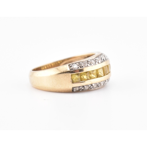 245 - A hallmarked 9ct gold, yellow sapphire and diamond ring. The 9ct yellow gold ring having a central r... 